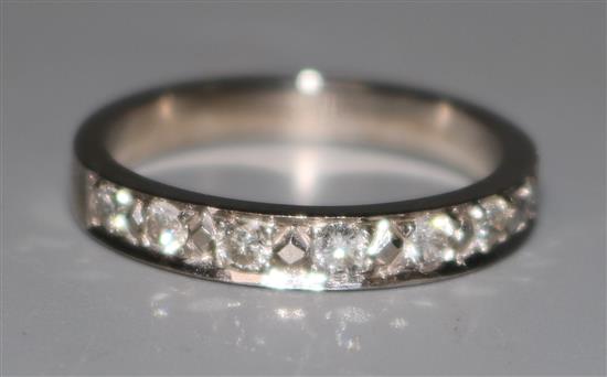 A 14ct gold and diamond half eternity ring, size M.